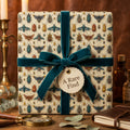 Unique bug print wrapping paper, tied with a teal velvet ribbon bow.