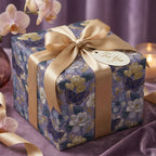 Elegant purple butterfly and floral wrapping paper with a gold satin bow by Wrapped Studios.