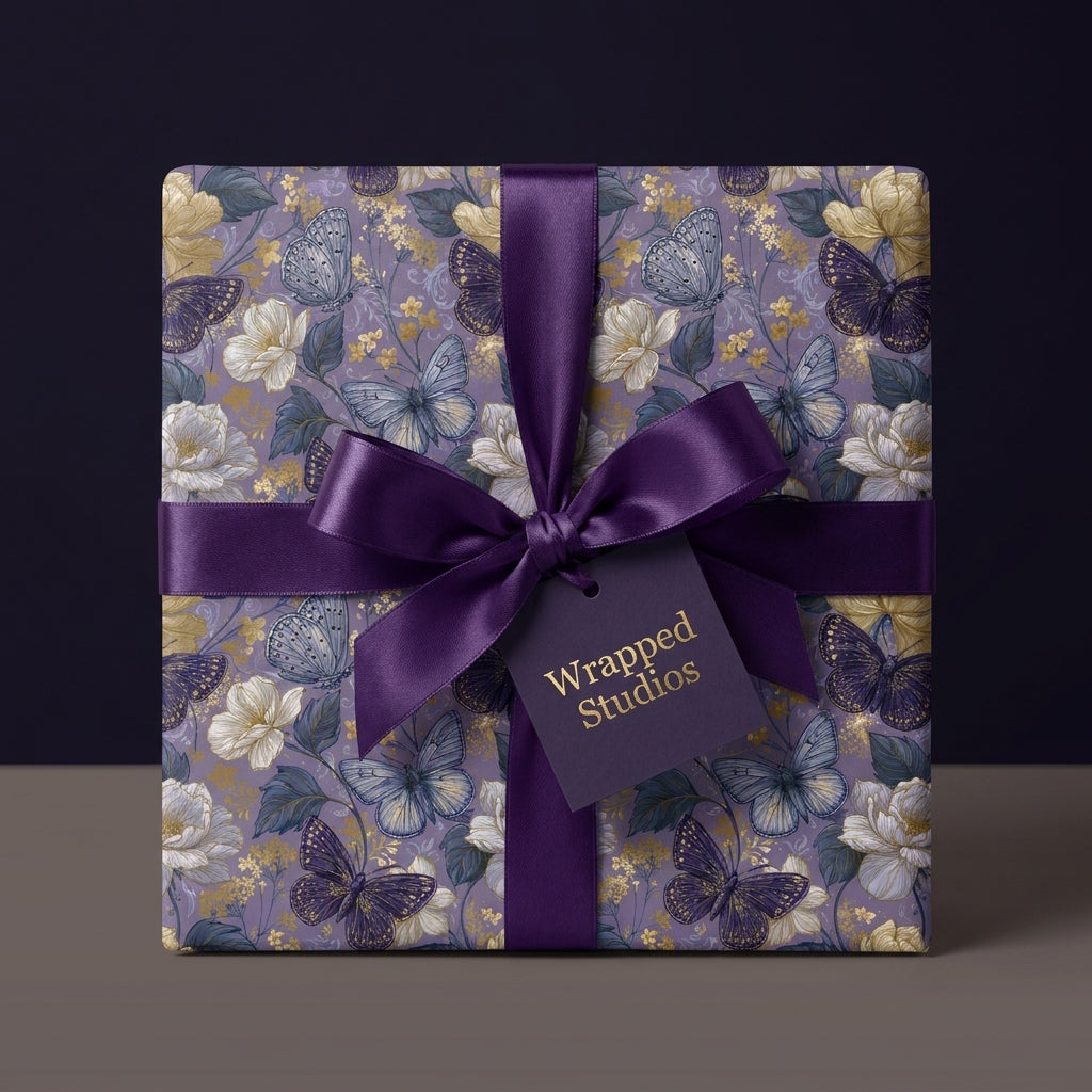 Luxury purple floral wrapping paper with butterflies and satin ribbon by Wrapped Studios.