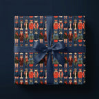 Cute Christmas cat wrapping paper featuring dressed-up cats and a navy ribbon, by Wrapped Studios.