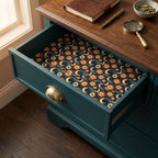 Celestial sun and moon wrapping paper used as a decorative drawer liner by Wrapped Studios.
