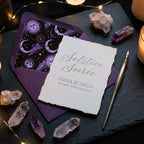 Gothic celestial wedding invitation with purple moon envelope liner and crystals by Wrapped Studios.