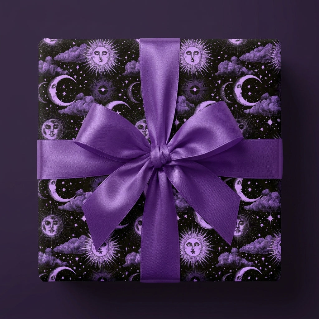 Purple celestial wrapping paper with vintage sun and moon patterns and a satin bow, by Wrapped Studios.