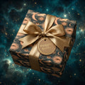 Luxury celestial wrapping paper with gold sun and moon patterns and satin bow, by Wrapped Studios.