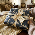 Celestial moon and stars gift wrap with cream bow and Dream Big tag, by Wrapped Studios.