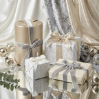 Luxury champagne and silver wedding wrapping paper with velvet ribbons on elegant gifts by Wrapped Studios.