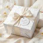 Elegant wedding wrapping paper in cream damask with satin bow, luxury gift wrap by Wrapped Studios.