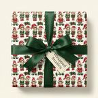 Vintage Christmas wrapping paper with retro elf pattern and green satin ribbon by Wrapped Studios.
