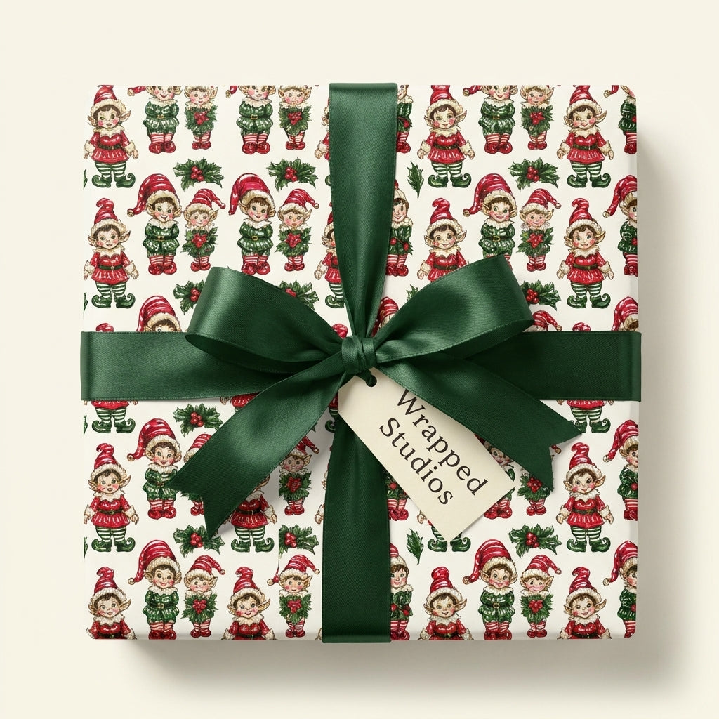 Vintage Christmas wrapping paper with retro elf pattern and green satin ribbon by Wrapped Studios.