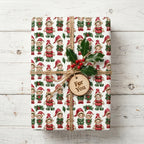 Vintage elf Christmas wrapping paper on a gift tied with rustic twine and holly, by Wrapped Studios.