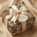 Elegant gift wrapped in vintage winter town wrapping paper with ivory ribbon and "Warm Wishes" tag.
