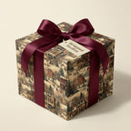 Elegant gift box with vintage winter village wrapping paper and a burgundy satin bow, perfect Christmas gift wrap.