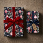 Luxury Christmas wrapping paper with red ornament print and velvet bow by Wrapped Studios.
