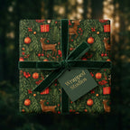 Luxury woodland Christmas wrapping paper with deer, tied with a green velvet ribbon by Wrapped Studios.