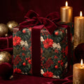 Luxury Christmas wrapping paper with red poinsettias and velvet bow by Wrapped Studios.
