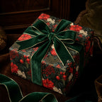 Luxury Christmas gift wrap with vintage dark floral pattern and green velvet ribbon by Wrapped Studios.