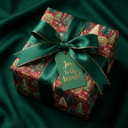 Luxury Christmas wrapping paper with a green satin bow and festive tree pattern by Wrapped Studios.