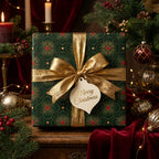 Luxury green and gold Christmas wrapping paper with a metallic gold ribbon by Wrapped Studios.