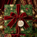 Luxury Christmas wrapping paper with green pine pattern and red velvet bow by Wrapped Studios.