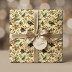 Vintage Christmas wrapping paper with holly pattern and champagne satin ribbon bow by Wrapped Studios.
