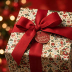 Vintage Christmas wrapping paper with Santa pattern and red ribbon, holiday gift wrap by Wrapped Studios.