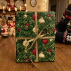 Green Christmas wrapping paper with vintage holiday ornaments and a gold glitter bow by Wrapped Studios.