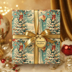 Square gift wrapped in vintage Christmas tree wrapping paper with gold ribbon and bow.