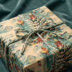 Vintage Christmas wrapping paper featuring a winter scene on a gift tied with rustic twine by Wrapped Studios.