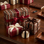 Cigar gift wrap with luxury satin and velvet ribbons on a wooden table, by Wrapped Studios.