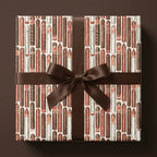 Cigar wrapping paper on a gift box with a brown bow, masculine Father's Day gift wrap by Wrapped Studios.