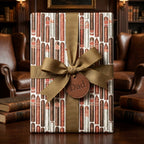 Masculine cigar wrapping paper with gold ribbon and Dad tag for Father's Day, by Wrapped Studios.