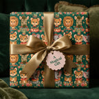 Vintage circus animal wrapping paper with a gold satin bow and tag by Wrapped Studios.
