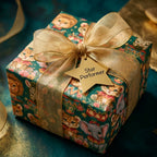 Whimsical circus animal birthday wrapping paper with gold bow and star tag by Wrapped Studios.
