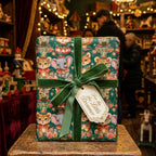 Whimsical circus birthday wrapping paper with green velvet ribbon and gift tag by Wrapped Studios.