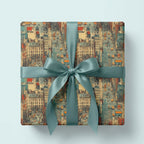 Square gift wrapped in vintage-style city scene wrapping paper with a teal satin ribbon.