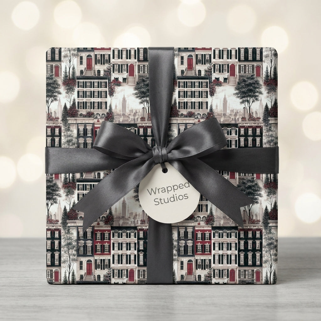 Luxury NYC townhouse holiday wrapping paper with a black ribbon bow by Wrapped Studios.