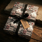 New York townhouse luxury gift wrap with a black ribbon and tag, by Wrapped Studios.