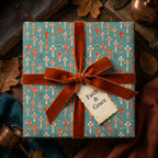 Christian cross baptism wrapping paper in teal and rust with a velvet bow by Wrapped Studios.