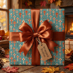Teal and terracotta Christian cross wrapping paper with a brown satin bow by Wrapped Studios.