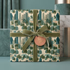City skyline wrapping paper with sage green velvet ribbon and gift tag by Wrapped Studios.
