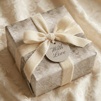 Luxury damask wedding wrapping paper with cream velvet bow and 'With Love' tag by Wrapped Studios.