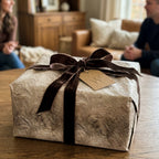 Elegant damask luxury gift wrap with a brown velvet ribbon and tag by Wrapped Studios.