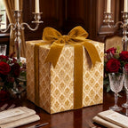 Luxury gold damask wrapping paper and velvet ribbon on an elegant holiday gift box by Wrapped Studios.