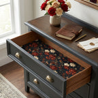 Moody dark floral wrapping paper used as a vintage drawer liner in a dresser by Wrapped Studios.