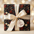 Vintage floral wrapping paper with a cream satin bow and gift tag, luxury gift wrap by Wrapped Studios.