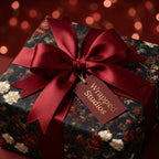 Luxury vintage floral wrapping paper with a burgundy satin bow by Wrapped Studios.