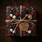 Vintage floral wrapping paper in dark navy and red with rustic twine, from Wrapped Studios.