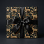 Vintage deer wrapping paper with floral print and black satin bow. Luxury holiday gift wrap by Wrapped Studios.