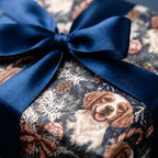 Holiday dog Christmas wrapping paper with spaniel illustrations and blue ribbon, by Wrapped Studios.