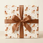 Cute watercolor puppy dog wrapping paper on a gift box with a brown satin bow by Wrapped Studios.